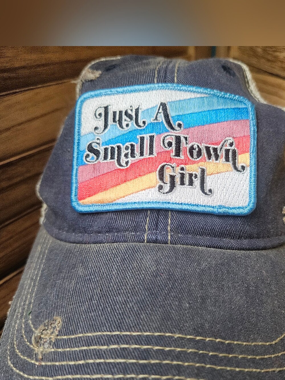 Judith March Trucker Hat “Just a Small Town Girl” Rainbow Distressed Snapback